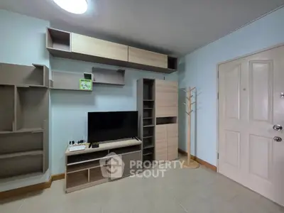 Modern living room with stylish shelving and TV setup