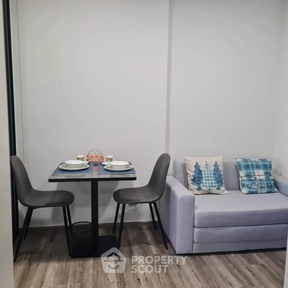 Cozy living room with compact dining area and stylish decor