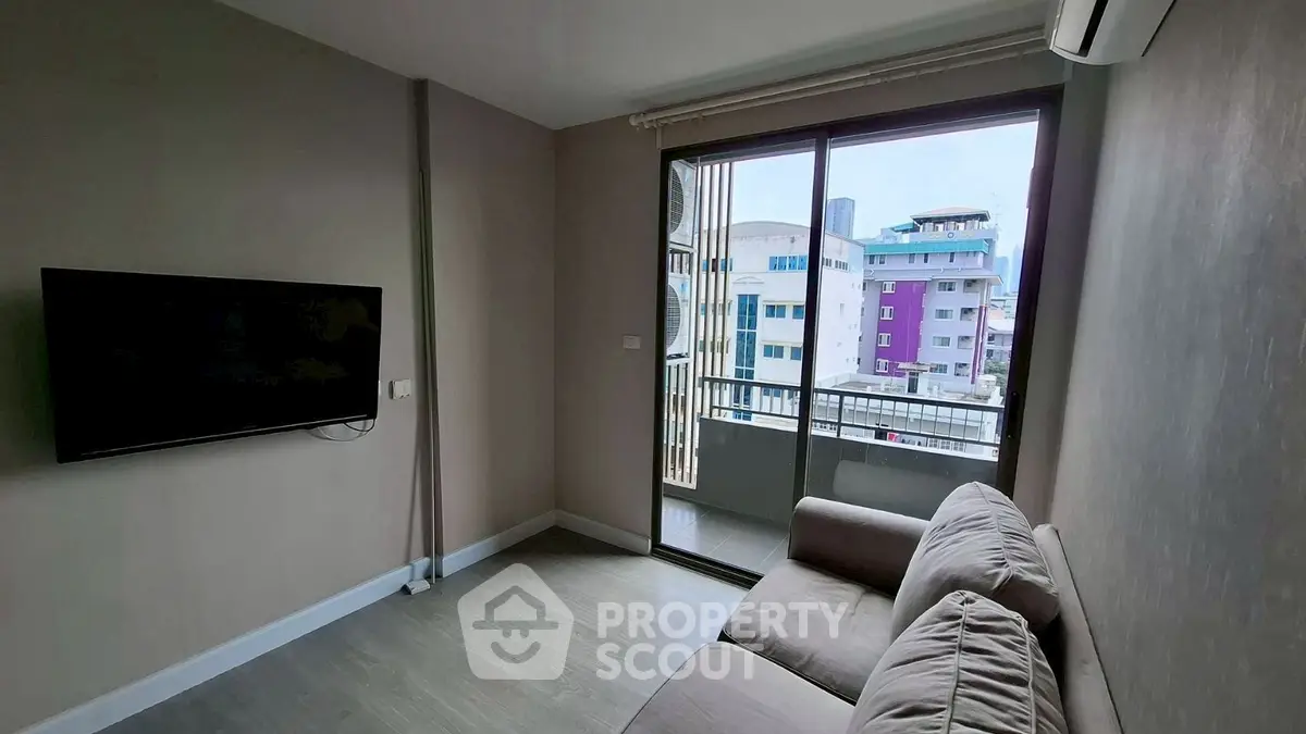 Modern living room with balcony view in urban apartment