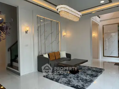 Luxurious living room with elegant chandelier and modern decor