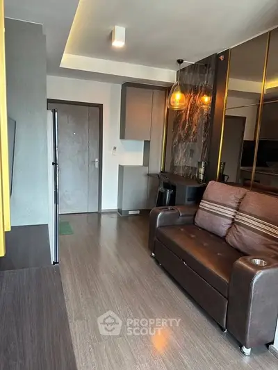 Modern living room with sleek design and cozy brown sofa