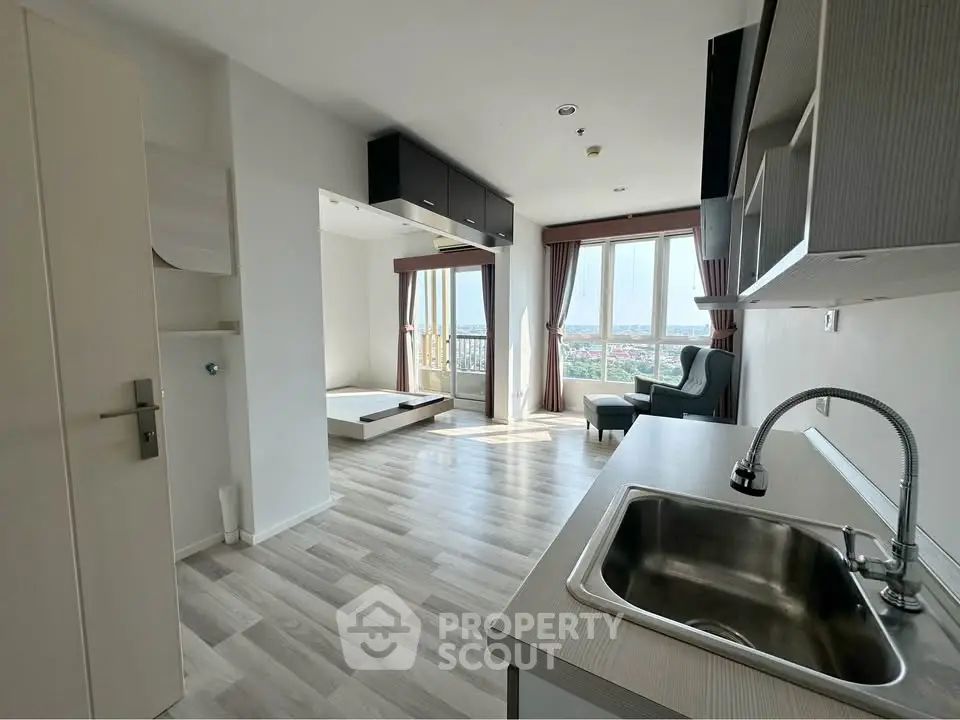 Modern studio apartment with open layout and stunning city view