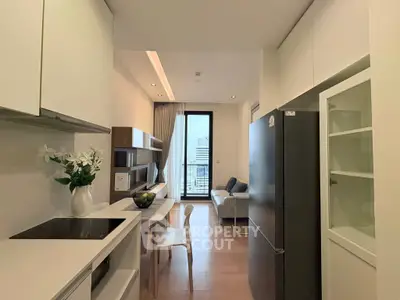 Modern kitchen with sleek design and city view, featuring open layout and stylish furniture.