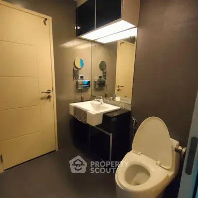 Modern bathroom with sleek fixtures and contemporary design.