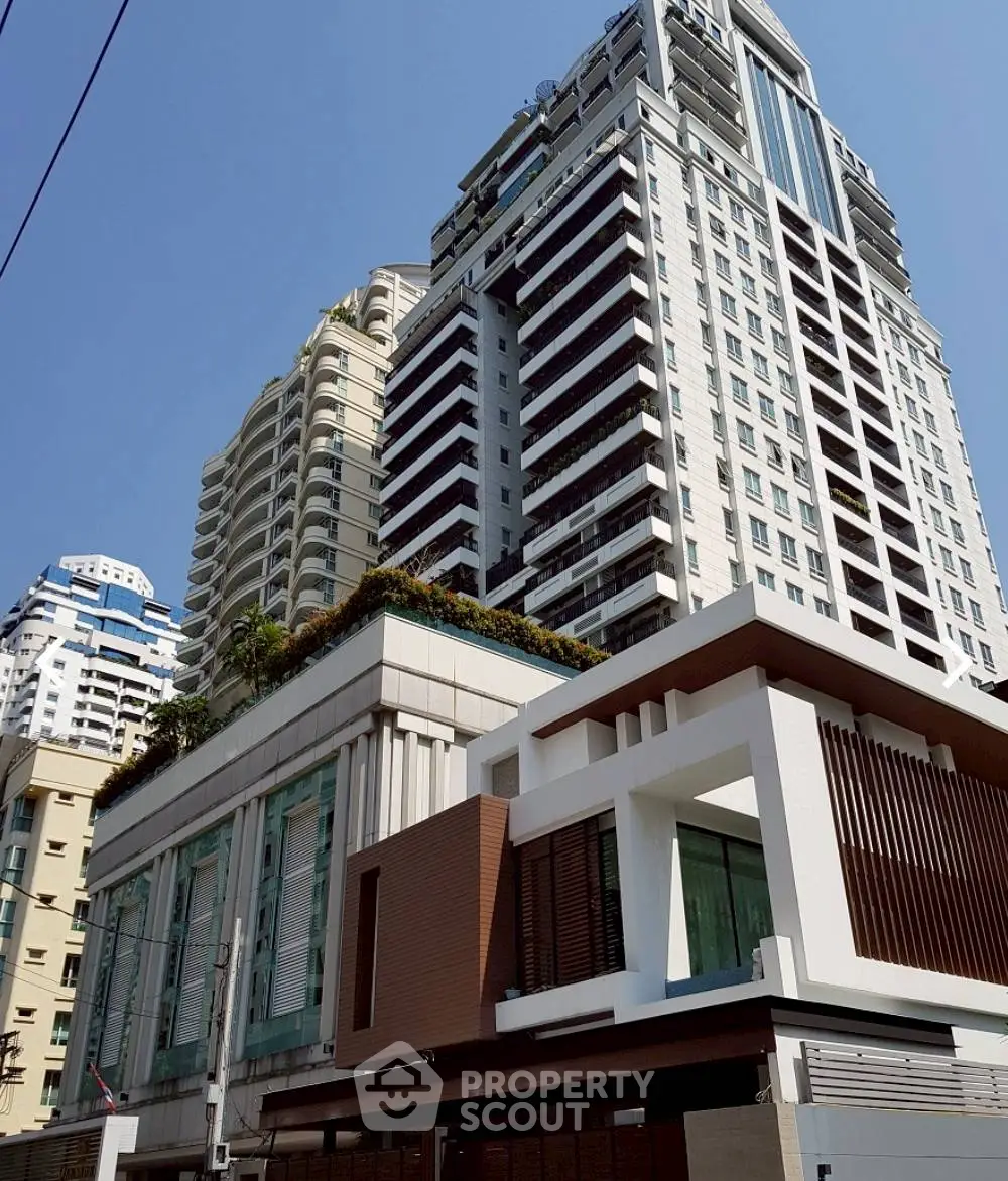 Stunning modern high-rise building with sleek architectural design in urban setting.