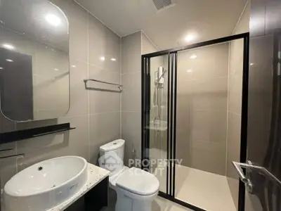 Modern bathroom with sleek shower enclosure and stylish fixtures
