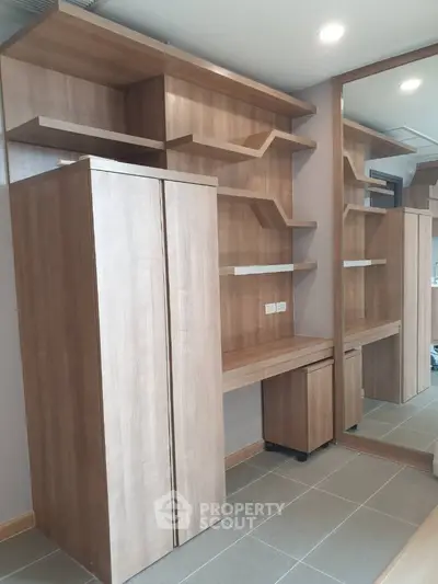 Modern wooden storage unit with mirror in stylish interior design