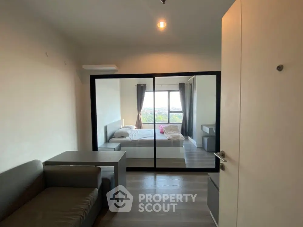 Modern apartment interior with cozy bedroom and stylish living area