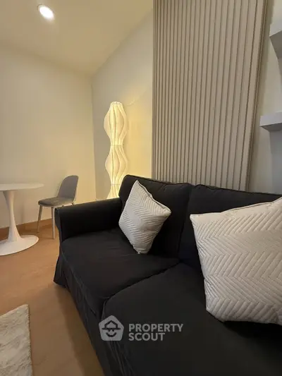 Cozy modern living room with stylish sofa and ambient lighting