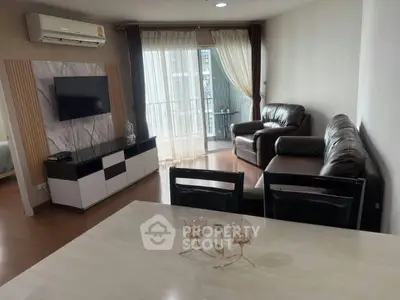 Modern living room with leather sofas and balcony view in a stylish apartment