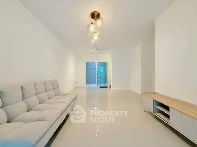 Spacious modern living room with sleek design and elegant lighting