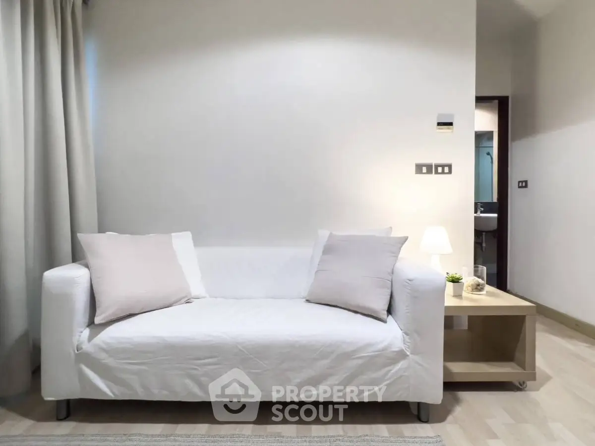 Modern living room with white sofa and minimalist decor