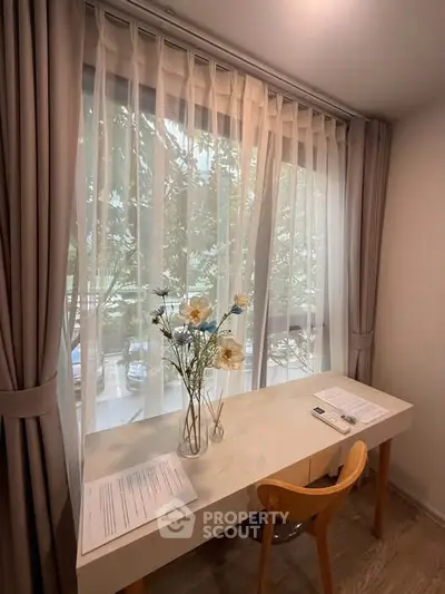 Charming study nook with natural light and elegant decor, perfect for productivity and relaxation.
