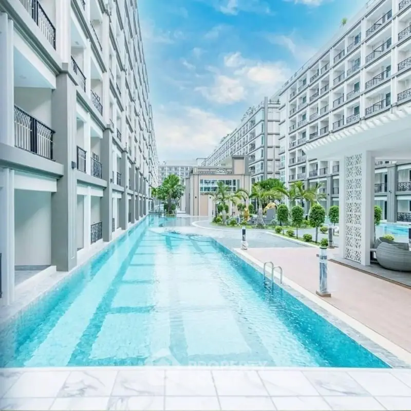 Luxurious apartment complex with stunning pool and modern architecture