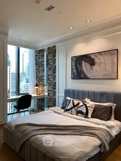 Luxurious bedroom with city view, modern decor, and stylish furnishings in a high-rise apartment.