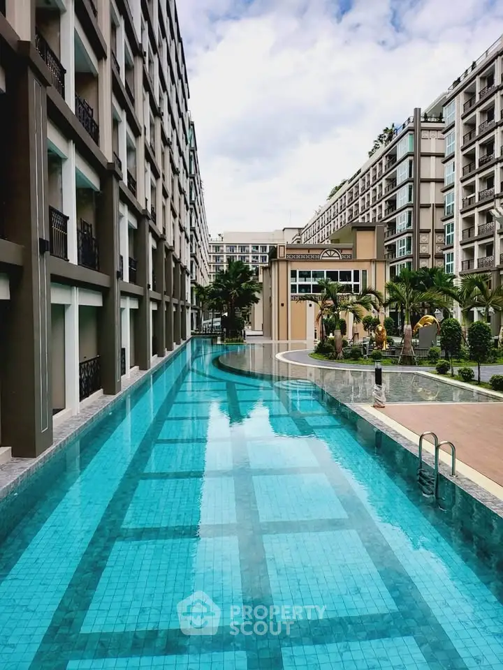 Luxurious residential complex with stunning outdoor pool and modern architecture.