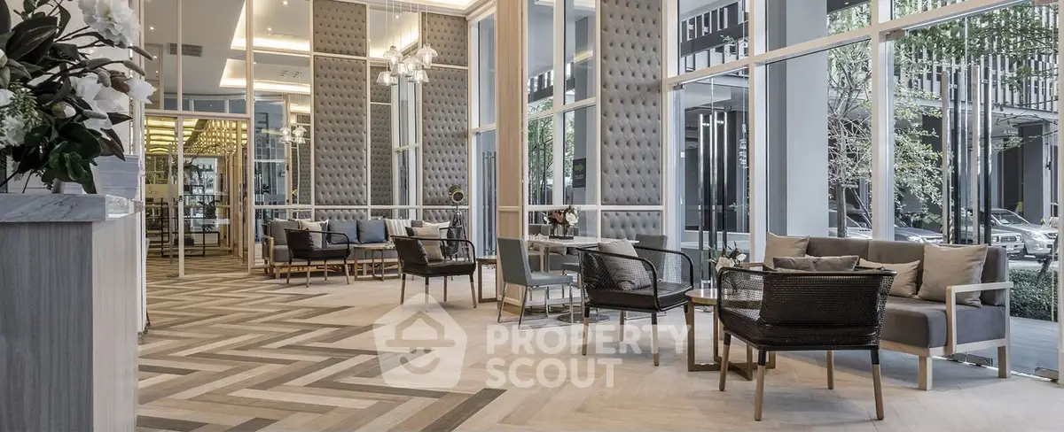 Luxurious modern lobby with elegant seating and floor-to-ceiling windows.