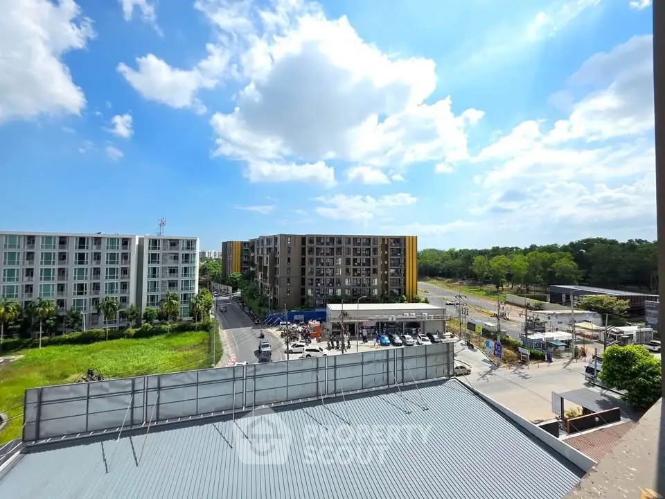 Stunning view of modern apartment buildings with lush greenery and clear blue skies.