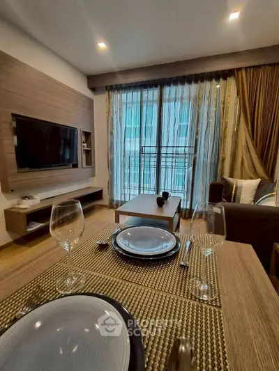 Stylish living room with modern decor and dining setup, perfect for urban living.