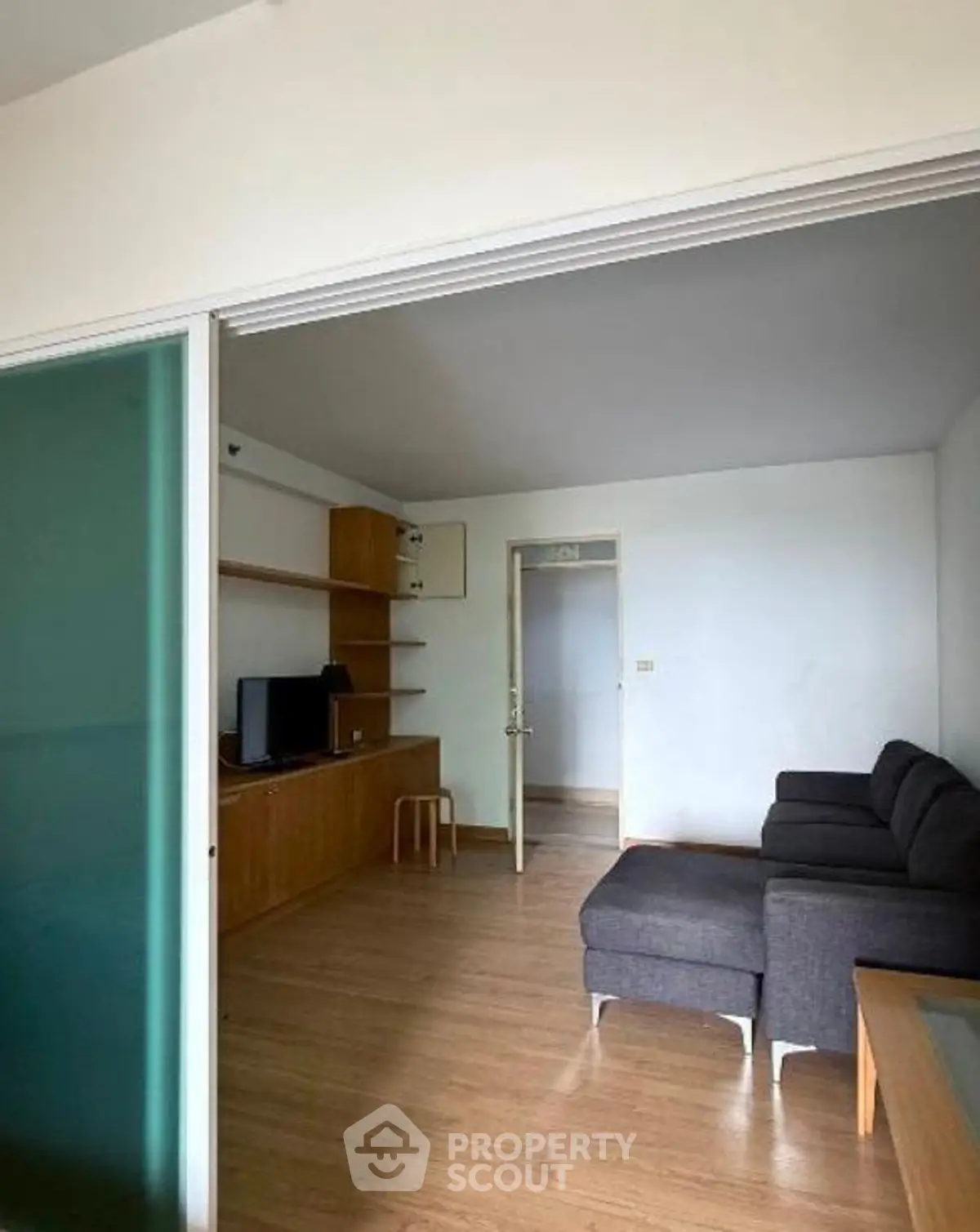 Modern living room with sleek furniture and wooden flooring