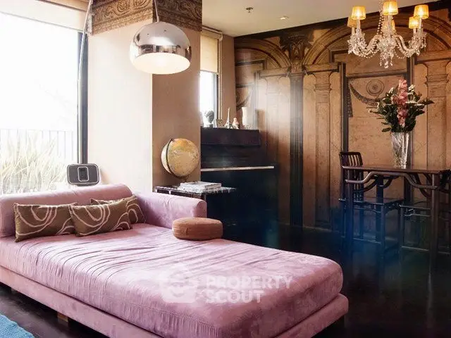 Luxurious living room with plush pink sofa and elegant decor