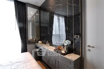 Luxurious bedroom with elegant marble accents and stylish decor