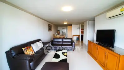Spacious living room with modern furniture and sleek design in a contemporary apartment.