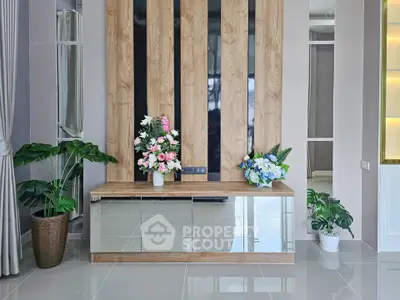 Modern living room with elegant decor and stylish wooden paneling