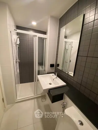 Modern bathroom with sleek shower and stylish tiles
