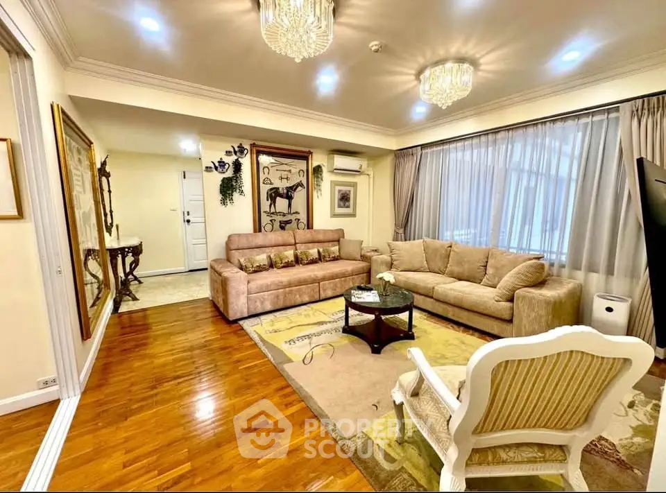 Luxurious living room with elegant decor and plush seating in a spacious apartment.