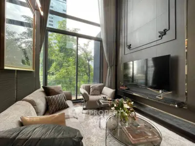 Luxurious high-ceiling living room with floor-to-ceiling windows offering a serene view, complemented by elegant furnishings and a sleek flat-screen TV.
