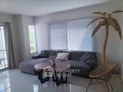 Stylish modern living room with large sofa and unique decor
