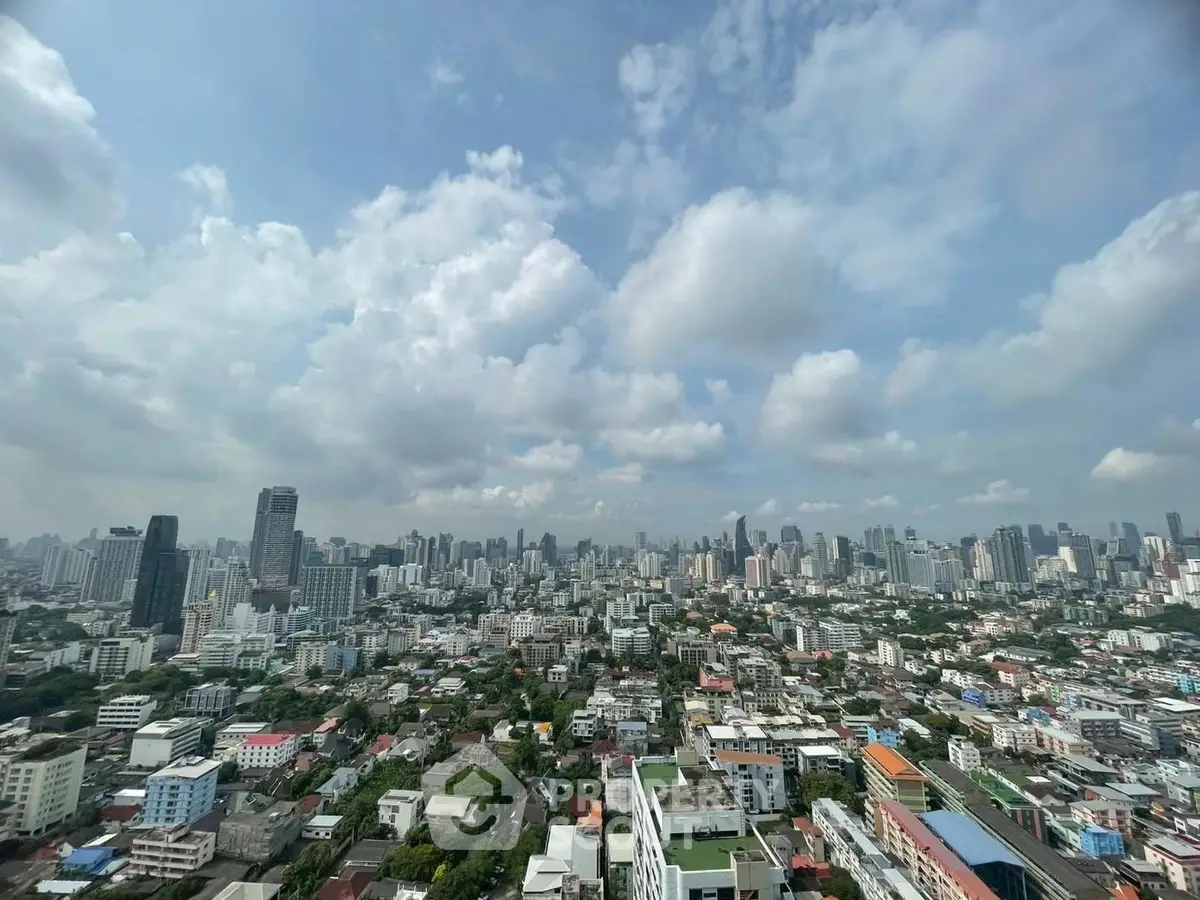 Stunning cityscape view showcasing a vibrant urban skyline under a clear blue sky.