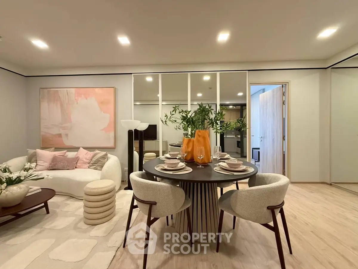 Elegant modern living room with stylish dining area and cozy seating, perfect for entertaining.