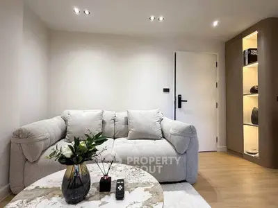 Cozy modern living room with plush sofa and elegant decor