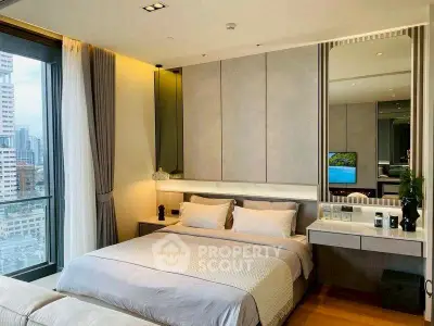 Luxurious bedroom with city view, modern decor, and elegant furnishings.