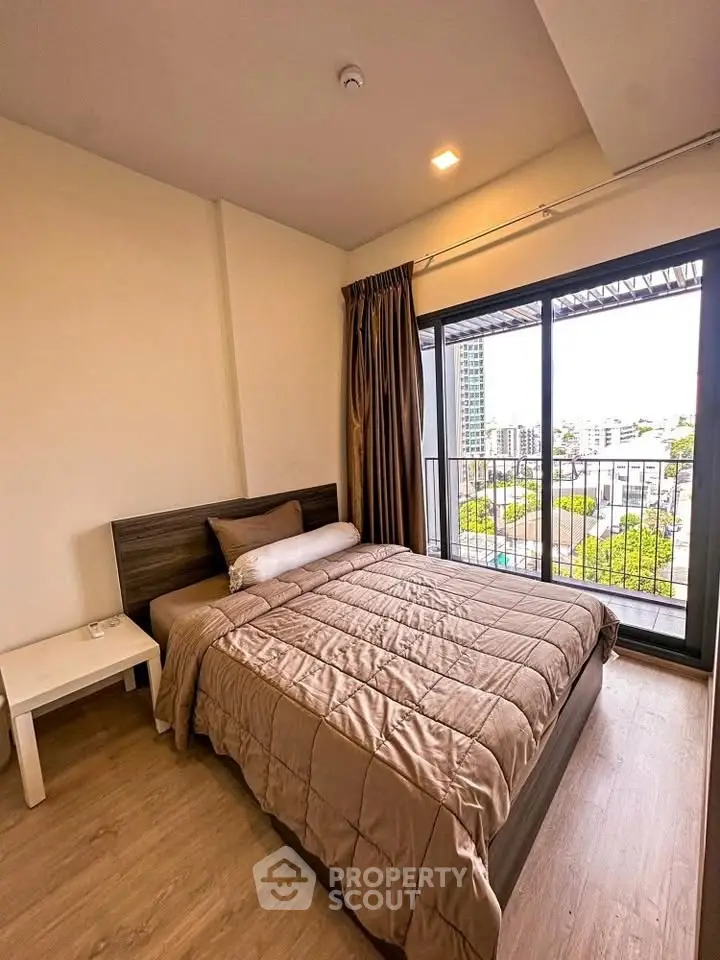 Cozy bedroom with balcony view in modern apartment