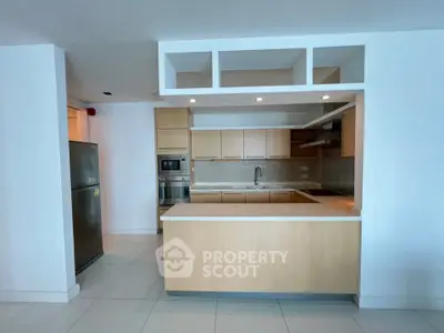 Modern kitchen with open layout and stainless steel appliances