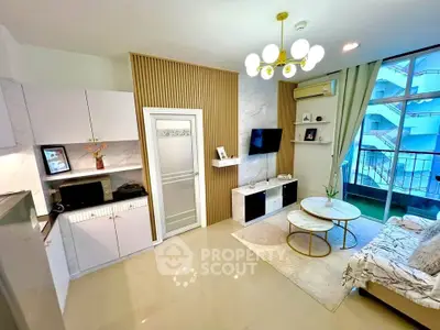 Modern living room with stylish decor and balcony view in a contemporary apartment.