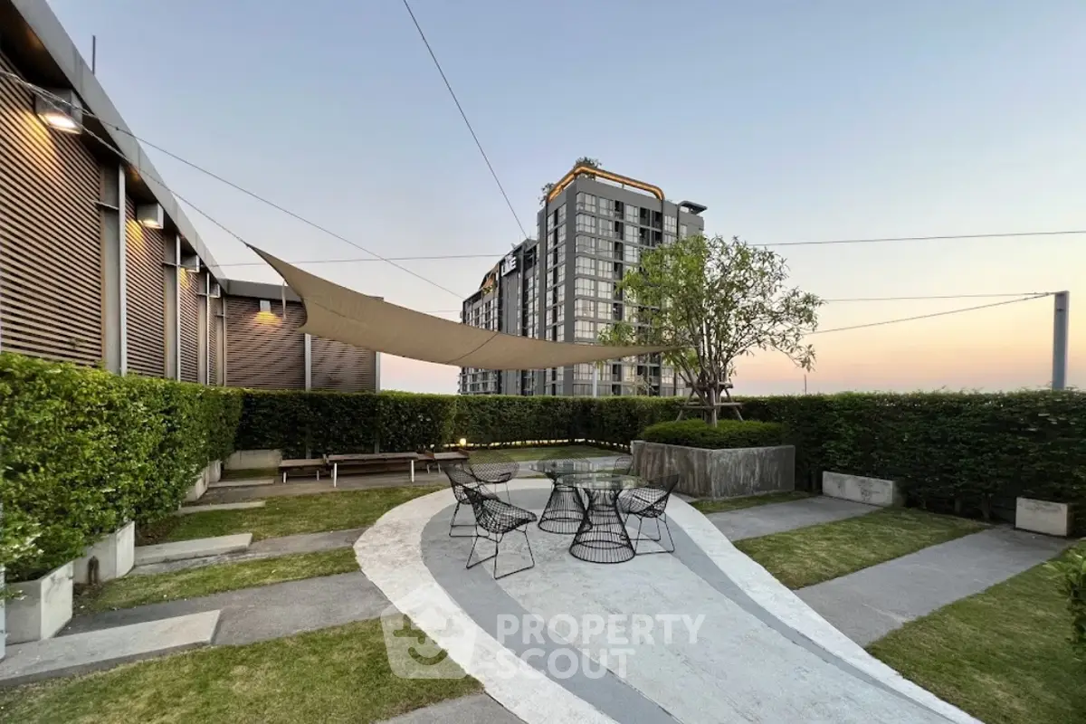 Modern rooftop garden with stylish seating and city view