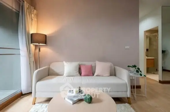 Cozy living room with modern sofa and soft lighting, perfect for relaxation.