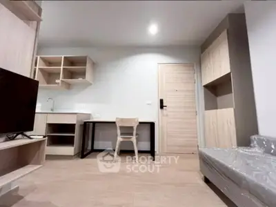 Modern studio apartment with sleek wooden furniture and compact design