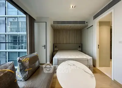 Modern studio apartment with stylish furnishings and large windows