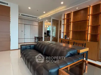 Luxurious modern living room with sleek leather sofa and elegant wooden accents
