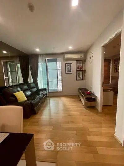 Spacious living room with wooden flooring and modern decor