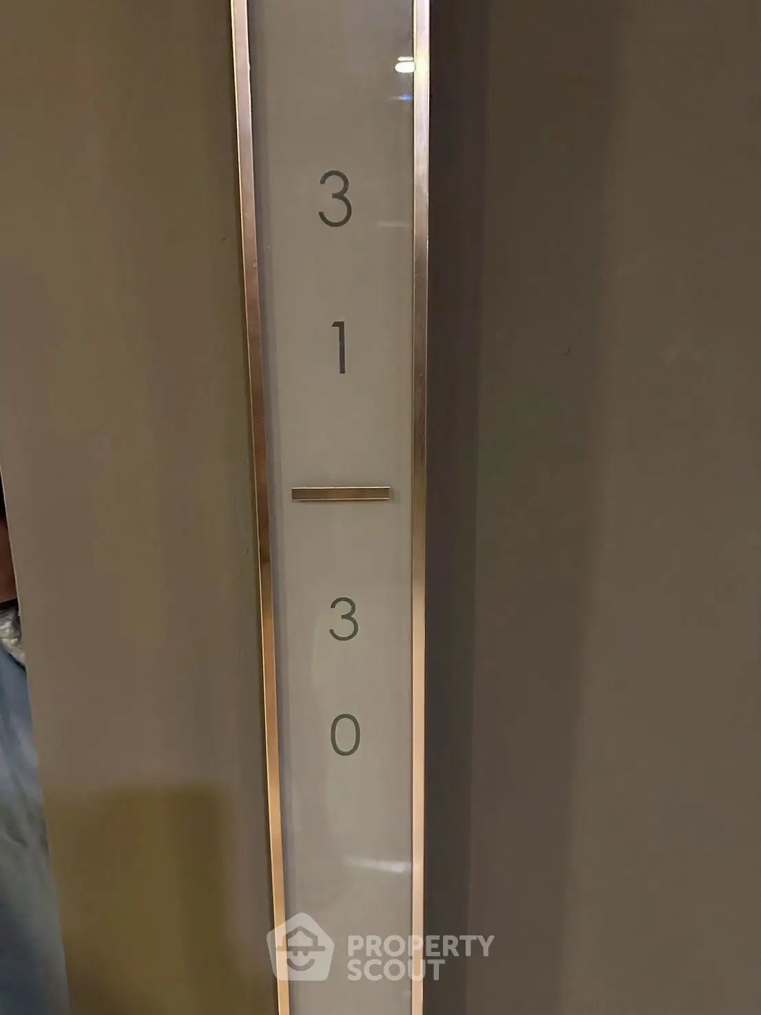 Modern elevator floor indicator with sleek design in a contemporary building.