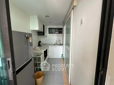 Compact kitchen with modern appliances and sleek design