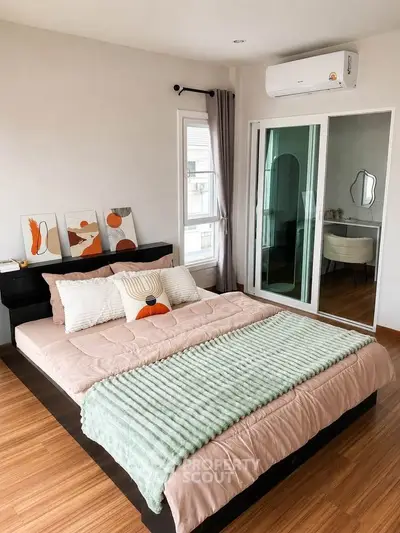 Modern bedroom with stylish decor and natural light
