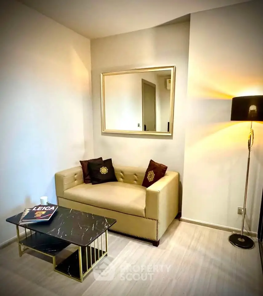 Chic modern living room with stylish sofa, elegant floor lamp, and sleek coffee table, perfect for urban living.