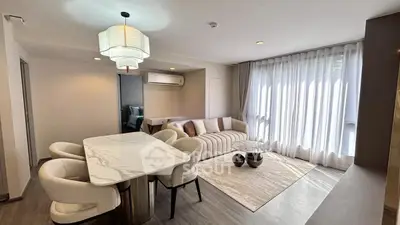 Elegant modern living room with chic dining area and stylish decor